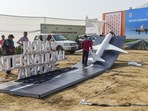Workers install a replica of an airplane as preparation are underway for the foundation stone laying ceremony of Noida International Airport in Jewar by Prime Minister Narendra Modi, on Wednesday.(PTI Photo) Workers install a replica of an airplane as preparation are underway for the foundation stone laying ceremony of Noida International Airport in Jewar by Prime Minister Narendra Modi, on Wednesday.(PTI Photo)