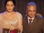 Neha Sharma and Piyush Mishra in a still from Illegal 2. Neha Sharma and Piyush Mishra in a still from Illegal 2.