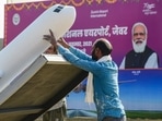 A worker installs a replica of an airplane as preparation are underway fo the foundation stone laying ceremony of Jewar Airport by Prime Minister Narendra Modi. A worker installs a replica of an airplane as preparation are underway fo the foundation stone laying ceremony of Jewar Airport by Prime Minister Narendra Modi.