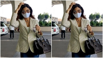 All masked up, Shilpa made her way to the airport. (HT Photos/Varinder Chawla) All masked up, Shilpa made her way to the airport. (HT Photos/Varinder Chawla)