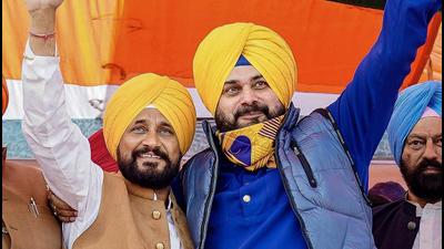 Punjab chief minister Charanjit Singh Channi and president of Punjab Congress Navjot Singh Sidhu during a rally at a local grain market in Moga on Thursday. (PTI) Punjab chief minister Charanjit Singh Channi and president of Punjab Congress Navjot Singh Sidhu during a rally at a local grain market in Moga on Thursday. (PTI)