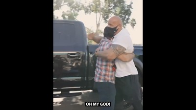 The image shows Dwayne Johnson hugging the navy veteran. (Instagram/@therock)