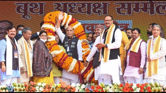 Defence Minister Rajnath Singh being garlanded during 'Booth Adhyaksh Sammelan', in Sitapur district, Thursday. (PTI)