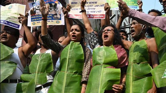 Members of various social and political organisations take part in a protest against policies of the Bharatiya Janata Party (BJP)-led central government, in Kolkata on Thursday. (AFP)