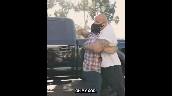 The image shows Dwayne Johnson hugging the navy veteran.(Instagram/@therock)