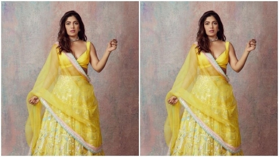 Bhumi Pednekar is a ray of sunshine in a yellow satin lehenga. Here's proof Bhumi accessorised her look for the day in statement silver earrings, a silver choker and a ring.(Instagram/@bhumipednekar)