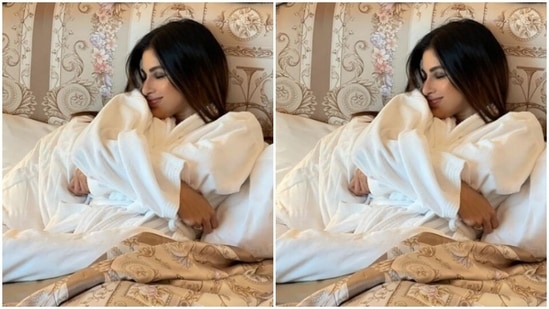 Mouni dressed up in a comfy white bathrobe and posed on her bed.(Instagram/@imouniroy)