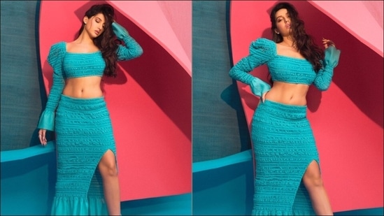 Nora Fatehi flaunts washboard abs in blue body-hugging co-ord set | Check pics The ensemble is credited to iconic luxury brand Hervé Léger that is ubiquitously known for its unforgettable bandage dresses that celebrate the female form. Wearing a dab of pink lipstick, Nora amplified the glam quotient with a dewy makeup look and was styled by Maneka Harisinghani.(Instagram/norafatehi)