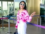 Nushrratt Bharuccha waves at paparazzi while entering the Mumbai airport. (Varinder Chawla)