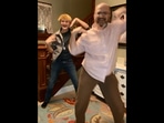 The image shows the US man dancing to Badshah’s Jugnu with his son.
