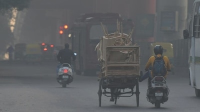 Commuters travel in dense smog during the morning hours in New Delhi. "The AQI today indicates 'Very Poor' category. Local surface winds are relatively low for the next 3 days that reduces the dispersion of pollutants leading to the deterioration of air quality but within the 'upper end of very poor' category for the next three days," SAFAR said in a bulletin. (ANI) Commuters travel in dense smog during the morning hours in New Delhi. "The AQI today indicates 'Very Poor' category. Local surface winds are relatively low for the next 3 days that reduces the dispersion of pollutants leading to the deterioration of air quality but within the 'upper end of very poor' category for the next three days," SAFAR said in a bulletin. (ANI)