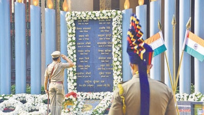 A police officer pays tribute to the martyrs at Police Martyrs Memorial at CP Office, on the occasion of the 13th anniversary of 26/11 terror attacks, in Mumbai,on Friday. (HT PHOTO/BHUSHAN KOYANDE) A police officer pays tribute to the martyrs at Police Martyrs Memorial at CP Office, on the occasion of the 13th anniversary of 26/11 terror attacks, in Mumbai,on Friday. (HT PHOTO/BHUSHAN KOYANDE)