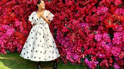 Pulling back her sleek tresses into a mid-parted low bun hairstyle, Kubbra accessorised her look with a pair of golden hoop earrings and a golden pendant from Misho. (Instagram/gauriandnainika) Pulling back her sleek tresses into a mid-parted low bun hairstyle, Kubbra accessorised her look with a pair of golden hoop earrings and a golden pendant from Misho. (Instagram/gauriandnainika)