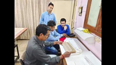Restoration of the rare manuscripts underway by INTACH experts. (HT Photo)
