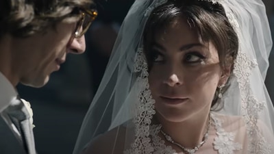 House of Gucci movie review: Lady Gaga and Adam Driver in a still from the movie. House of Gucci movie review: Lady Gaga and Adam Driver in a still from the movie.