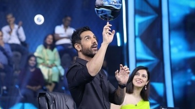 John Abraham showed some tricks with a football as Divya Khosla Kumar looked on in awe. John Abraham showed some tricks with a football as Divya Khosla Kumar looked on in awe.