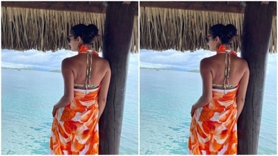 Pooka decked up in a white printed bikini and draped a pareo around. (Instagram/@poojabatra)