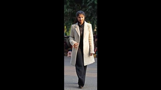 Arshiya Batra’s look comprised a high neck sweater, long coat, loose pants, jewellery and flats. (Photo: Gokul VS/HT)