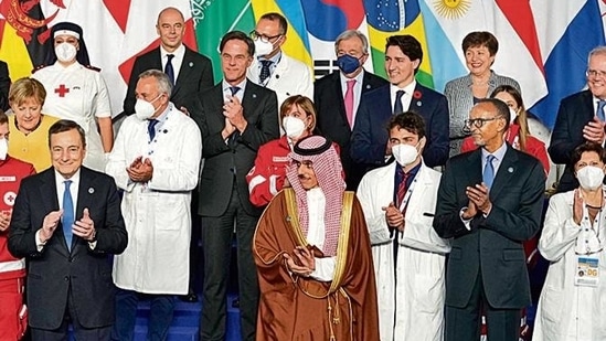 Medical personnel and world leaders pose for a group photo at the La Nuvola conference center for the G20 summit in Rome in October. AP Medical personnel and world leaders pose for a group photo at the La Nuvola conference center for the G20 summit in Rome in October. AP