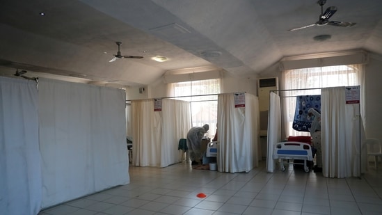 Healthcare workers assist patients being treated at a makeshift hospital run by charity organisation The Gift of the Givers, during the coronavirus disease (Covid-19) outbreak at Johannesburg in South Africa.&nbsp;(File Photo / REUTERS)