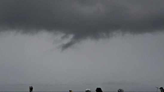 Dark clouds seen over Marina beach in Chennai, Tamil Nadu. (AFP)