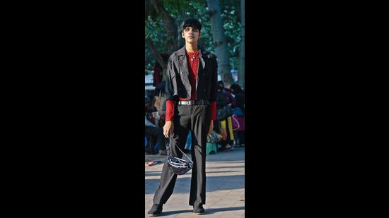 Puneet Kathuria paired up a black crop jacket with a fitted red pullover and black pants.