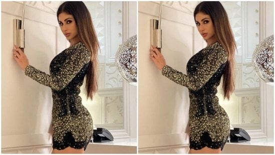 The full-sleeved dress is embellished in gold and made for a stunning evening date attire.(Instagram/@imouniroy)