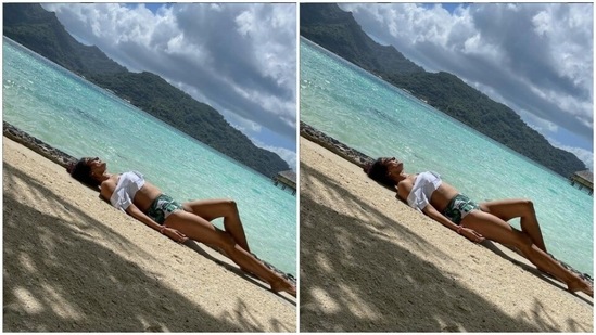 Pooja's beachwear collection is drool-worthy. A few days back, Pooja chilled on the beach in a white cropped top and a pair of white and green pair of shorts.(Instagram/@poojabatra)