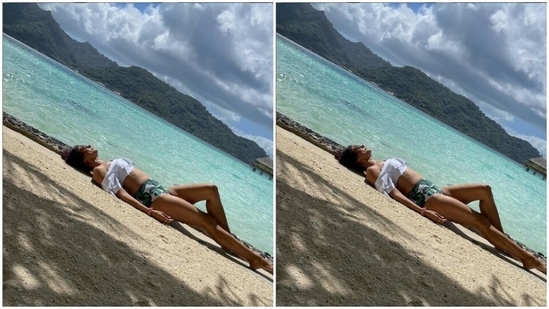 Pooja's beachwear collection is drool-worthy. A few days back, Pooja chilled on the beach in a white cropped top and a pair of white and green pair of shorts.(Instagram/@poojabatra)