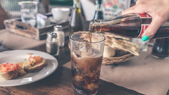 Avoid sodas and sugary drinks: It is important to stay hydrated but not with carbonated drinks. Drinking fizzy beverages might leave you feeling more bloated. Instead, have other fluids like soup, herbal teas and lots of water.(Pexels)