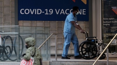 A sign outside of a hospital advertises the Covid-19 vaccine. (AFP)