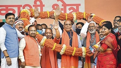 Union Minister Rajnath Singh, UP Chief Minister Yogi Adityanath and UP BJP President Swatantra Dev Singh being garlanded during the 'Booth Adhyaksh Sammelan', in Jaunpur on Saturday. (PTI) Union Minister Rajnath Singh, UP Chief Minister Yogi Adityanath and UP BJP President Swatantra Dev Singh being garlanded during the 'Booth Adhyaksh Sammelan', in Jaunpur on Saturday. (PTI)
