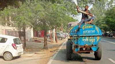 The Noida authority said that the water is also sprayed on trees and plants on the roadside as they get covered with dust. (Sourced) The Noida authority said that the water is also sprayed on trees and plants on the roadside as they get covered with dust. (Sourced)