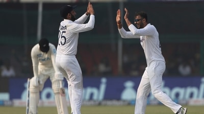 India's bowler Axar Patel, right, celebrates the dismissal of New Zealand's Tom Blundell with his teammate Cheteshwar Pujara during the day three of their first test cricket match in Kanpur, India, Saturday, Nov. 27, 2021. (AP) India's bowler Axar Patel, right, celebrates the dismissal of New Zealand's Tom Blundell with his teammate Cheteshwar Pujara during the day three of their first test cricket match in Kanpur, India, Saturday, Nov. 27, 2021. (AP)