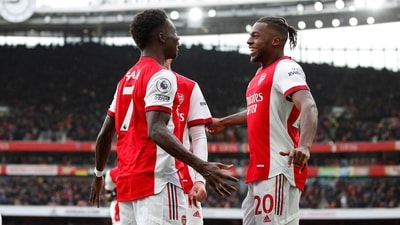 Arsenal's Bukayo Saka celebrates scoring their first goal with Nuno Tavares (Action Images via Reuters)