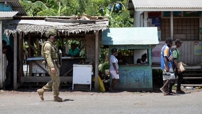 An Australian Army soldier from the Joint Task Group 637.3 patrolling during a community engagement patrol through the Solomon Islands capital of Honiara. (AFP) An Australian Army soldier from the Joint Task Group 637.3 patrolling during a community engagement patrol through the Solomon Islands capital of Honiara. (AFP)