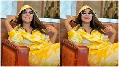 Hina paired the hoodie with matching tie-dye printed joggers. It comes with a gathered hemline, loose silhouette and high waist. She kept the look fuss-free by choosing minimal accessories with the printed ensemble. A pair of broad frame sunglasses and a sleek ring rounded it off. (Instagram/@realhinakhan) Hina paired the hoodie with matching tie-dye printed joggers. It comes with a gathered hemline, loose silhouette and high waist. She kept the look fuss-free by choosing minimal accessories with the printed ensemble. A pair of broad frame sunglasses and a sleek ring rounded it off. (Instagram/@realhinakhan)