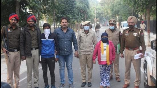 The couple, who was childless, had kidnapped the ragpicker’s son eight days ago in Ludhiana. They were arrested from a forest area in Lakhimpur Kheri near the Nepal border. (HT Photo)