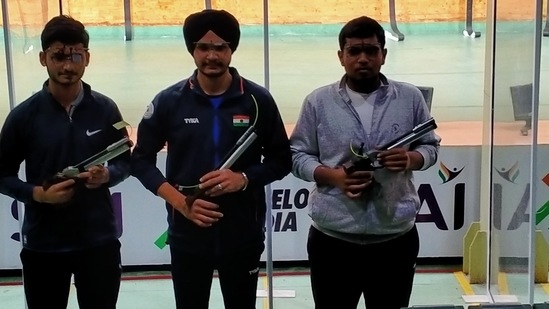 &nbsp;Shiva Narwal (left), Sarabjot Singh and Harsh Gupta pose after the men's final at senior national championships.