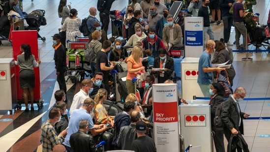 People queue to get on the Air France flight to Paris at OR Tambo's airport in Johannesburg, South Africa, on November 26.(AP Photo)