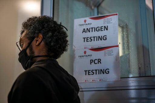A person queues to be tested for Covid-19 in Johannesburg, South Africa, on November 26, 2021. (For representation purpose) (AP Photo/Jerome Delay) A person queues to be tested for Covid-19 in Johannesburg, South Africa, on November 26, 2021. (For representation purpose) (AP Photo/Jerome Delay)