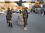Taliban fighters guard a street in Kabul, Afghanistan.