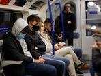 Passengers, some wearing face coverings to combat the spread of Covid-19, travel on the London underground in central London.(AFP) Passengers, some wearing face coverings to combat the spread of Covid-19, travel on the London underground in central London.(AFP)