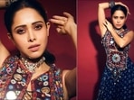 Chhorii star Nushrratt Bharuccha recently treated the Internet with sultry pictures from her latest photoshoot and fans could not keep calm as she cut a sensuous style in an indigo blue draped dhoti skirt set.(Instagram/nushrrattbharuccha)