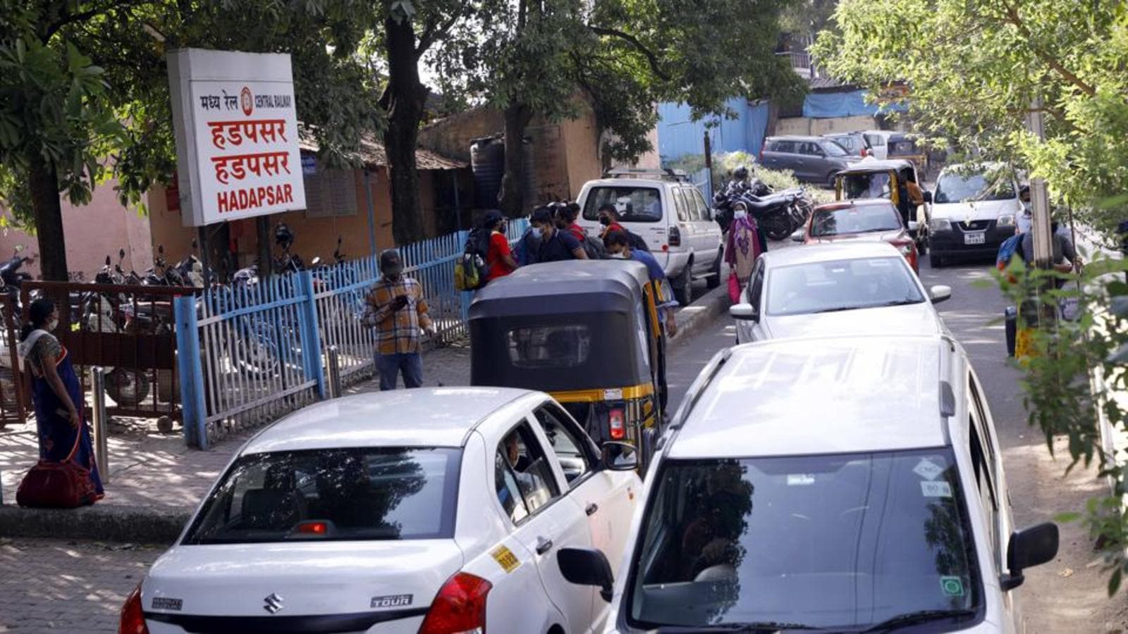 Narrow access road, small entry gate makes boarding at Hadapsar railway