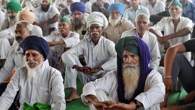Farmers sitting on a demonstration during the ongoing farmers' protest at the Delhi-Ghazipur border, in New Delhi. (ANI)