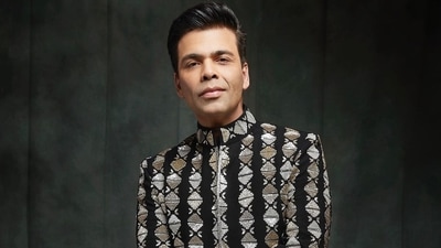 The full sleeves sherwani jacket was teamed with a pair of straight fit black trousers and Karan completed his attire with a pair of black breeches. (Instagram/karanjohar) The full sleeves sherwani jacket was teamed with a pair of straight fit black trousers and Karan completed his attire with a pair of black breeches. (Instagram/karanjohar)