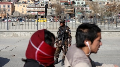 A Taliban fighter stands as he guards a checkpoint in Kabul, Afghanistan. (REUTERS)