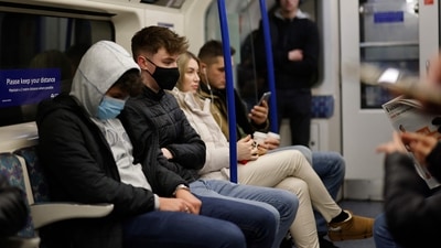 Passengers, some wearing face coverings to combat the spread of Covid-19, travel on the London underground in central London. (AFP) Passengers, some wearing face coverings to combat the spread of Covid-19, travel on the London underground in central London. (AFP)