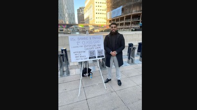 The image shows the man with a placard. (LinkedIn/@Emmanuel Fajuyigbe)